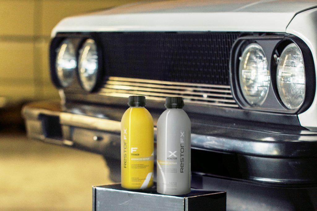RestorFX Advanced Repair 2-part paint finish restoration product bottles in front of a white vintage 1976 Lancia Beta Spider