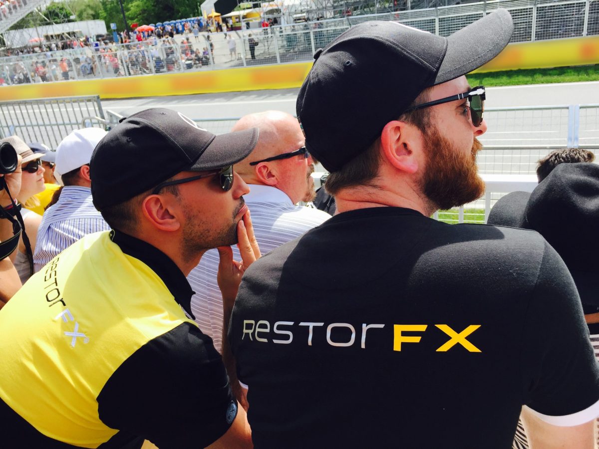 RestorFX Founder and Latin America Division Director spectating on the bleachers at a Grand Prix auto race